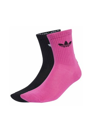 Black and pink crew socks with ribbed texture and contrasting cuffs. Features the Adidas logo in black on the pink sock.