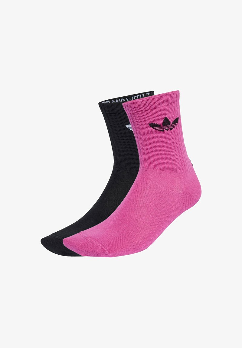Calze a maniche corte nere e rosa con texture a coste e polsini a contrasto. Presentano il logo Adidas in nero sulla calza rosa.
