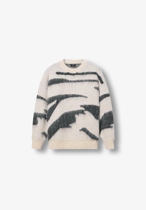 Čupavi pleteni pulover u krem boji s tamnozelenim apstraktnim uzorcima. Ima rebrasti okrugli izrez i manšete. Mekana, strukturirana tkanina.