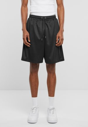 Pantalones cortos deportivos negros hechos de un material texturizado con cintura elástica y cordón. Presenta bolsillos laterales y un corte holgado.
