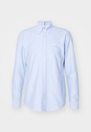Light blue long-sleeve button-up shirt in cotton, featuring a classic collar, front buttons, and a small embroidered logo on the chest.