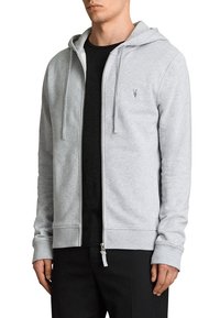 Felpa grigia con zip e cappuccio regolabile, dotata di un logo sul lato sinistro del petto, realizzata in materiale morbido con polsini e orlo a costine.
