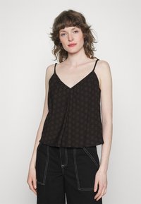 Top preto sem mangas com decote em V, design franzido e padrão floral em tons mais claros. Acentuado com alças finas e ajustáveis.