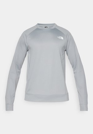 Hellgrauer Rundhals-Sweatshirt mit langen Ärmeln. Eigens ribbeliger Saum und Bündchen. Das Logo von The North Face ist auf der Brust angebracht.