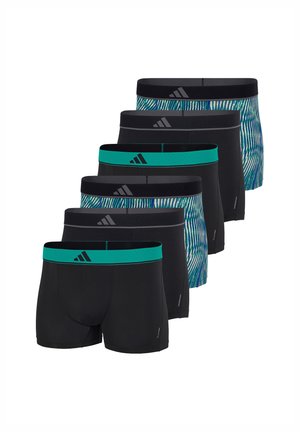 Zes herenslips in afwisselend effen zwart met gekleurde tailles en blauwgroene patroonontwerpen, gerangschikt in een verspringende rij.