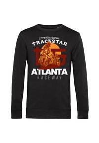 Černá košile s dlouhými rukávy s grafickým designem motocyklu a jezdce na pozadí oranžového kruhu, s textem "TRACKSTAR ATLANTA RACEWAY".