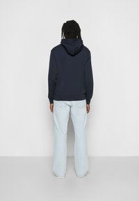 Calvin Klein MICRO LOGO REPREVE HOODIE - Camisola - calvin navy