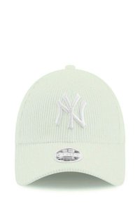 Light green corduroy cap with a white embroidered "NY" logo, circular silver tag reading "9FORTY WOMEN," adjustable back closure.