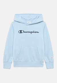 Sweat à capuche bleu clair en coton, avec une poche kangourou à l'avant et un logo "Champion" noir sur la poitrine. Poignets et ourlet côtelés.