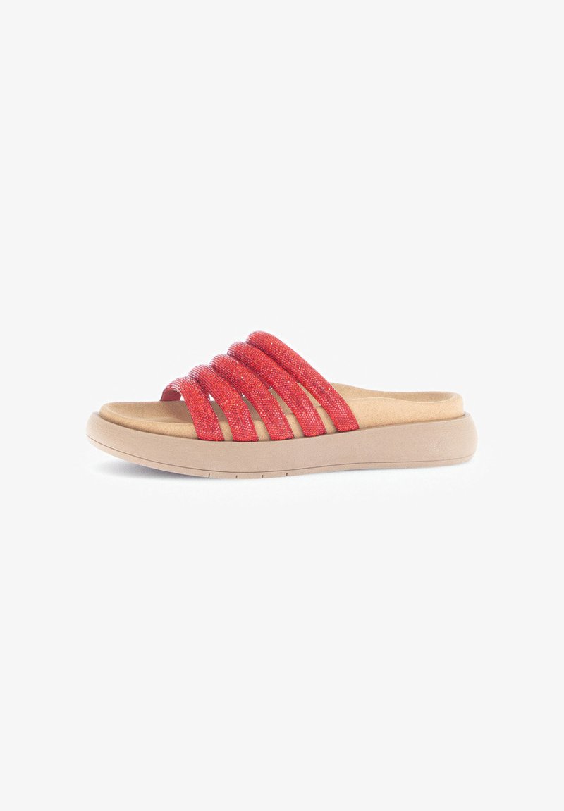 Red slip-on sandals with four textured straps, featuring a soft, cushioned footbed and a lightweight beige sole.