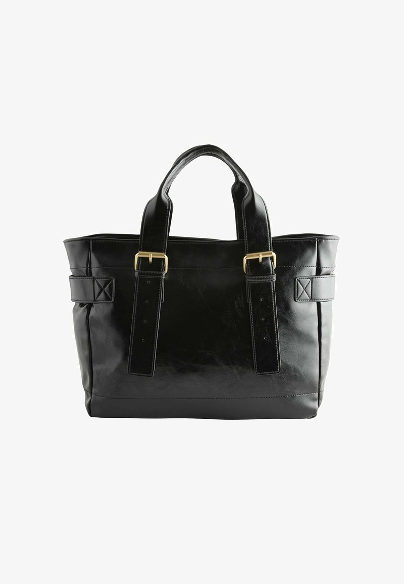 Sac fourre-tout en cuir noir avec double anses, présentant des finitions en métal doré et une forme rigide ; comprend des bretelles ajustables et un fond plat.