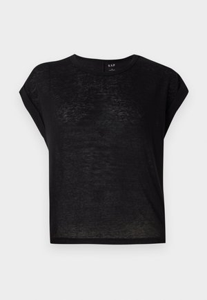T-shirt noir à manches courtes avec une coupe décontractée. Fabriqué en tissu léger et légèrement transparent. Doté d'un col rond et de manches retroussées.