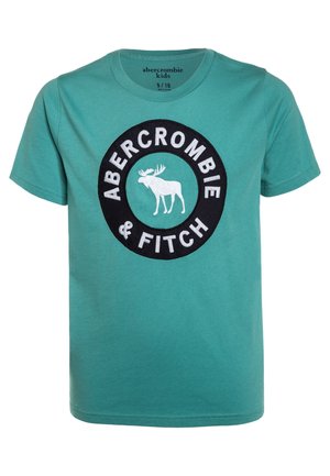 Børne-T-shirt med korte ærmer i blågrøn med rund halsudskæring, der har en sort cirkulær logo-patch med hvid elg og teksten "Abercrombie & Fitch".