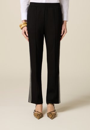 JOGGERS MET TWEEKLEURIGE TAPE - Pantaloni sportivi - nero