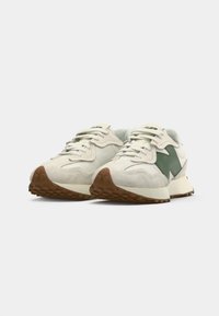 Sneakers featuring a white and green color scheme, suede and textile material, round toe, textured midsole, and patterned rubber outsole.