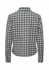 Chemise à manches longues à carreaux noir et blanc avec poignets boutonnés, vue de dos sur fond blanc.