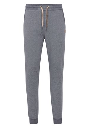 Grå strikkede joggers med en ribbet tekstur, elastisk talje og kontrasterende snøre. Har tapered ben og ribbede ankler.