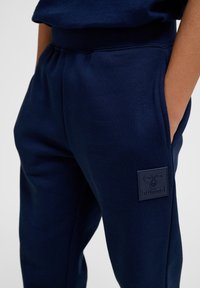 Hummel CLEAN ADJUSTABLE - Trainingsbroek - black iris
