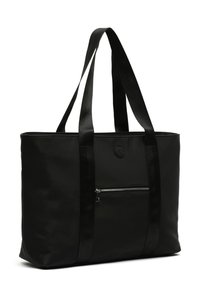 Black tote bag made of smooth nylon with wide black strap handles. Features a front zip pocket and a round logo on the front.