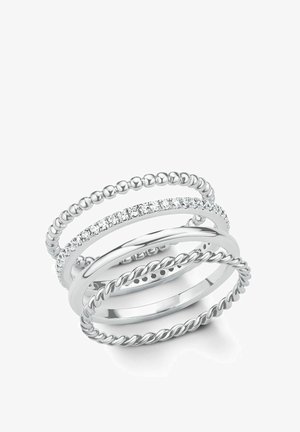 Four elegant silver bands stacked together, featuring beaded, twisted, and gem-studded designs, showcasing a variety of textures.