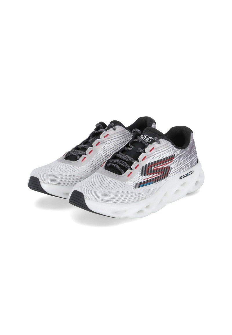 White mesh athletic shoes with black accents, textured surface, red eyelets, and a cushioned sole featuring cutouts for ventilation.