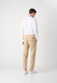 Tommy Jeans RYAN - Hlače - gentle gold