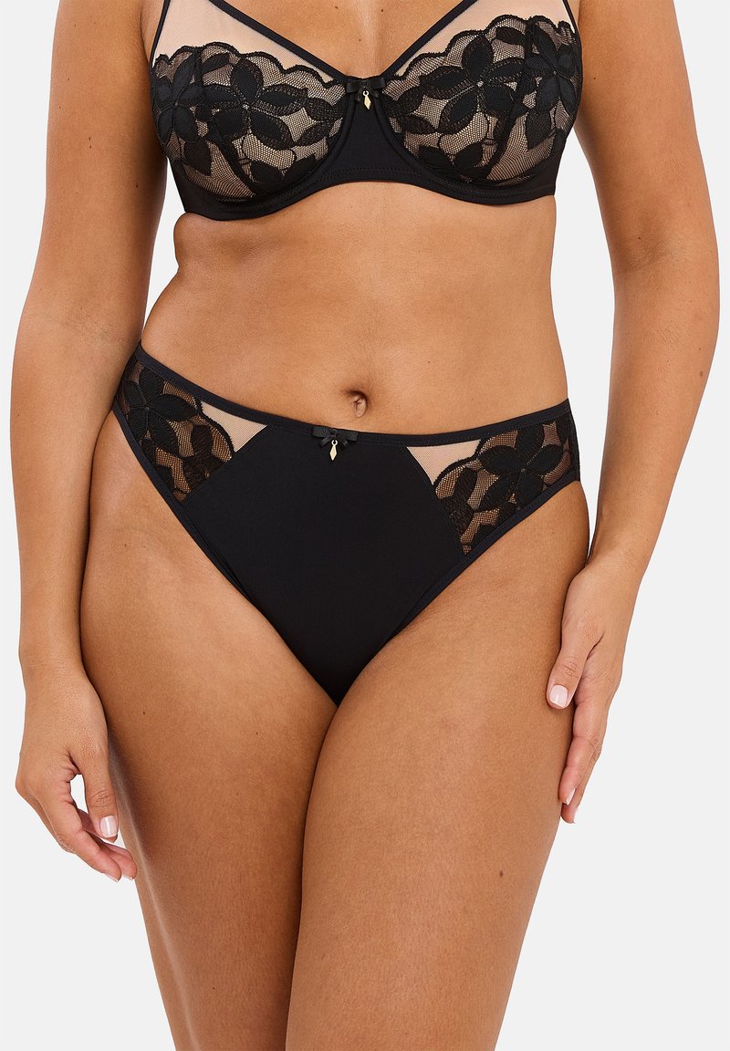 Ensemble de lingerie noir comprenant un soutien-gorge en mesh transparent avec un superposition de dentelle florale et un matching culotte haute, accentué d'un petit détail en forme de nœud.