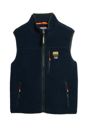Navy blue fleece vest with front zipper, three zippered pockets with orange pulls, and a small Superdry Outdoor Co patch on chest.