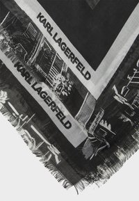 Eșarfă alb-negru cu branding Karl Lagerfeld, cu margine franjurată și imprimeuri grafice de peisaje urbane pe tot parcursul designului.