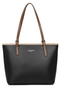 Sac fourre-tout noir en matériau lisse avec des anses en cuir marron, comportant une garniture beige et des détails de logo en argent à l'avant.