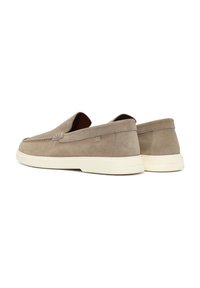 Beige suede slip-on shoes with a rounded toe, contrasting white rubber sole, and subtle stitching details along the upper.