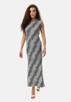 Maxi dress with a floral pattern in black and white, featuring a fitted silhouette and cap sleeves, made from a smooth fabric.
