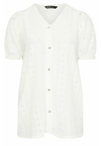 Blusa bianca a maniche corte con scollo a V, realizzata in tessuto texturizzato. Presenta chiusura con bottoni, maniche a palloncino e motivo floreale a occhio di pernice.