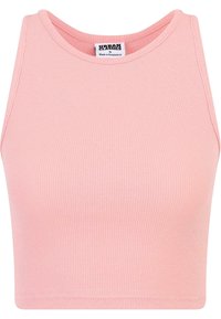 Světle růžový crop top z žebrované tkaniny. Má kulatý výstřih a bezrukávový střih, který zdůrazňuje hladkou strukturu.