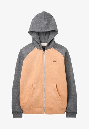 Sweat à capuche zippé gris et pêche avec une capuche, des poches avant et des manches raglan contrastées ; fabriqué en tissu doux et texturé.