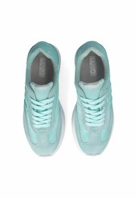Apair of mint green sneakers featuring a smooth upper with suede accents, round toe, flat laces, and a white rubber sole.