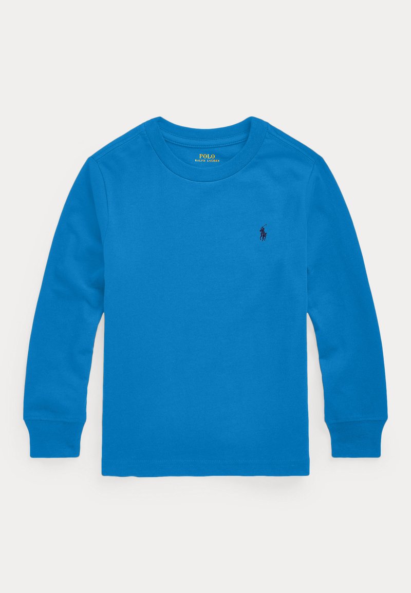 Μακρυμάνικη μπλούζα σε φωτεινό μπλε από βαμβάκι, με ραμμένο λαιμόκοψο και μανσέτες. Ένα μικρό ναυτικό λογότυπο είναι κεντημένο στο στήθος.