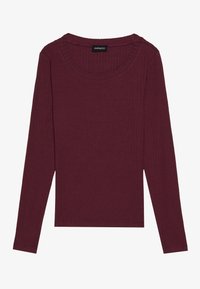 Burgundy long-sleeve top made from ribbed fabric. Features a round neckline and a straight hem, with minimal stitching details.