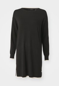 Zwarte lange mouw trui jurk met crèmekleurige geribbelde accenten bij de halslijn en de zoom. Beschikt over zijsplitten voor een comfortabele beweging.
