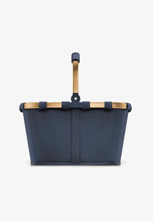 Navy fabric basket with a gold metal frame, featuring a curved handle and a rectangular shape. Visible straps secure the fabric to the frame.