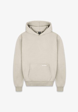 Haut à capuche beige avec une grande poche avant, en tissu doux, avec des poignets et un ourlet côtelés, et une étiquette de logo sur la poche. Capuche avec cordon de serrage réglable.