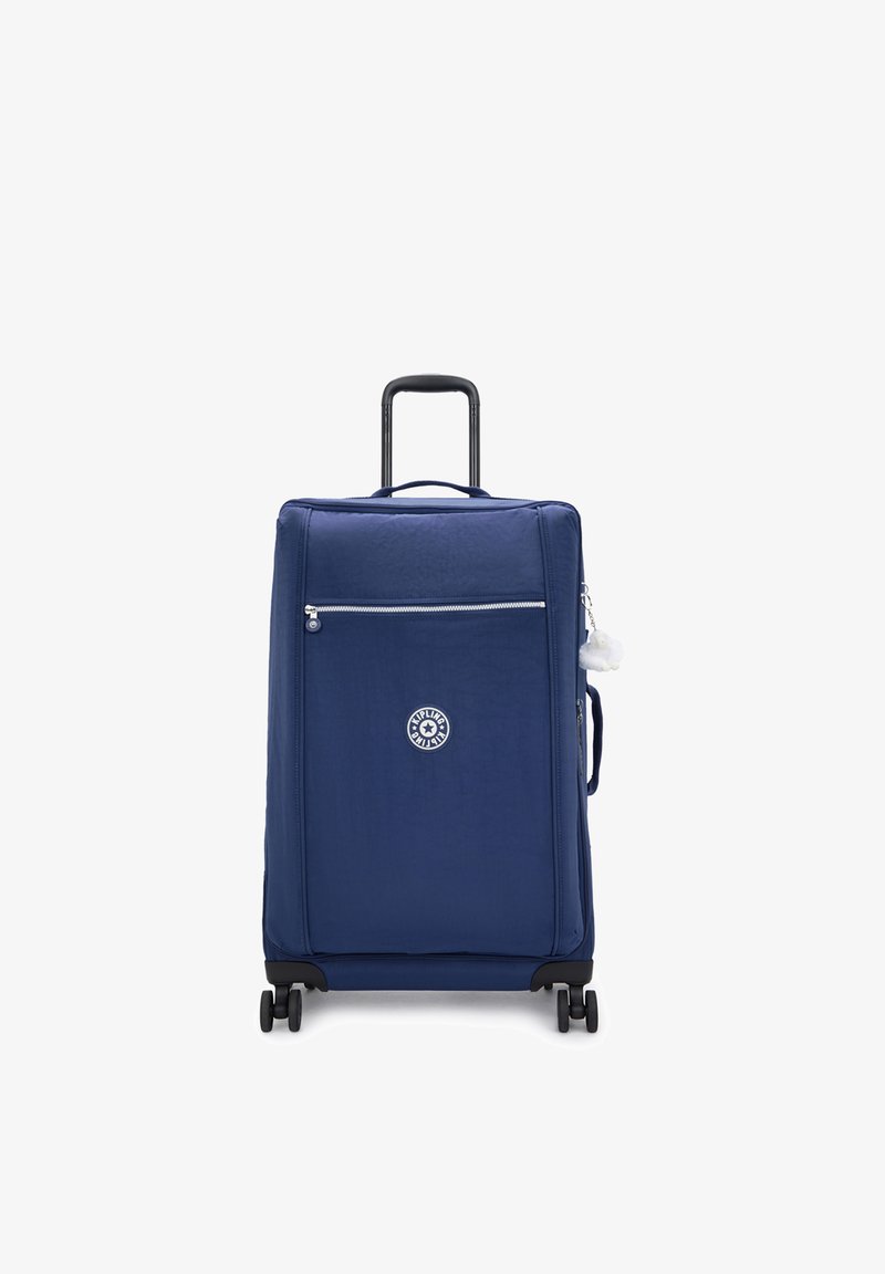 Valise souple bleu marine avec poche avant zippée, poignée télescopique et quatre roues. Présente un logo rond à l'avant.