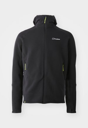 Čierna mikina na zips vyrobená z mäkkej látky, s vysokým golierom, dvoma bočnými vreckami na zips s neonovo zelenými akcentmi a logom na hrudi.