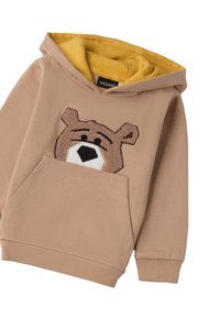 Haut à capuche beige avec une appliqué d'ours sur la poche avant. Doté d'une doublure intérieure jaune et de poignets côtelés. Fabriqué en tissu doux.