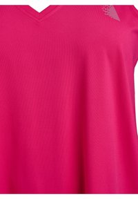 Fuchsia V-neck top made of soft fabric, featuring a smooth texture and a subtle geometric pattern near the neckline.