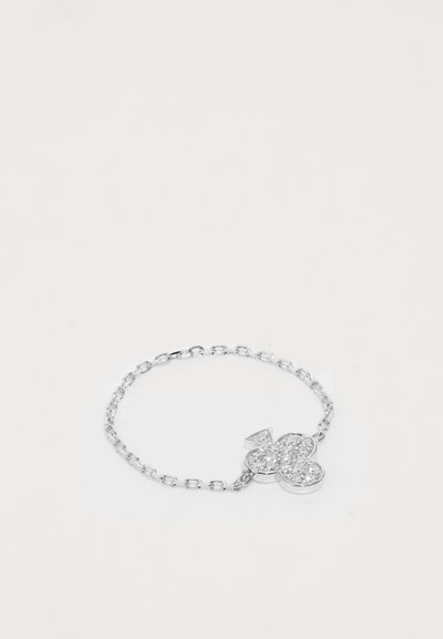 Silver chain bracelet featuring a clover-shaped pendant adorned with clear crystals, creating a sparkling effect against the sleek metal.