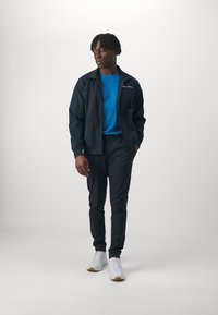Champion ICON ELASTIC CUFF PANTS - Tepláky - navy