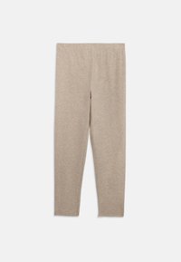 Beige leggings i mjukt, stretchigt tyg. Åtsittande modell med en slät elastisk midja och inga synliga sömmar eller mönster.