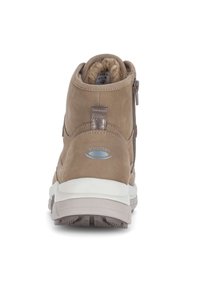 Scarpa marrone di altezza media con rivestimento in pelle e pelliccia, presenta una cerniera laterale, un tallone rinforzato e una suola testurizzata per una maggiore aderenza.