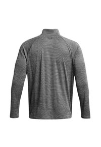 Gray long-sleeve athletic shirt with a mock collar, textured fabric, and subtle striped pattern; features a logo on the back.
